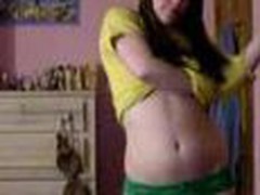 Juvenile teen bedroom strip, yellow top and little green pants cast aside showing her little tits and pussy.