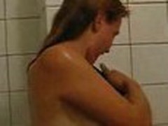 Girlie doesn't shy to be filmed on camera naked. She continues showering, when her chap enters bathroom.
