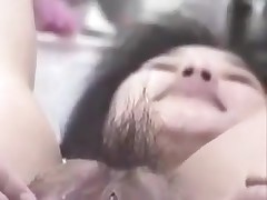 Korean wench with large vagina and pouty lips gets naughty on camera. She stuffs her unshaved vagina with fingers, metal balls and even a bottle. This cunt can swallow a lot of jism too!
